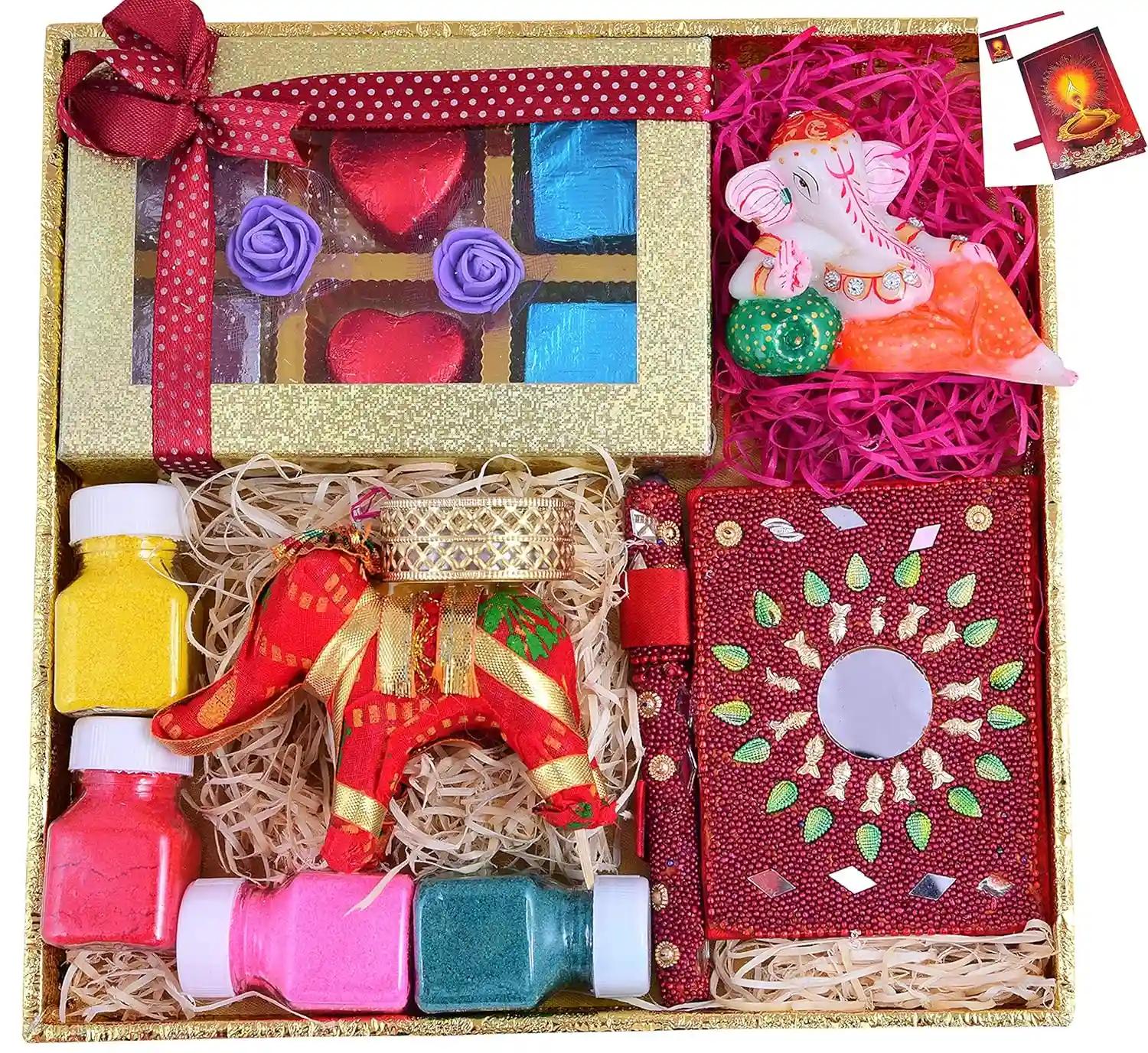 MANTOUSS Diwali chocolate gift pack-1 designer tray+1 Handmade chocolate box+1 Rajasthani diary and pen+1 murti of resting Ganesha+1 Elephant candle tealight stand+rangoli colours+Diwali greeting card